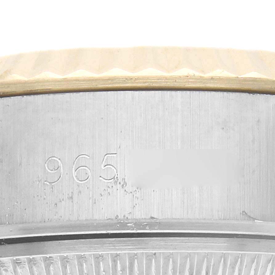 The image shows a close-up of the fluted bezel edge and case side of a Rolex Datejust 69173 Women
s Steel and Gold (two tone) Champagne Dial 69173 Women
s Steel and Gold (two tone) Champagne Dial watch.