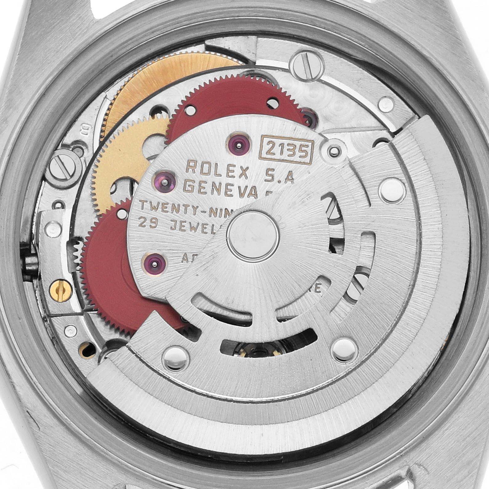 The image shows a close-up view of the movement mechanism of a Rolex Datejust 69173 Women
s Steel and Gold (two tone) Champagne Dial 69173 Women
s Steel and Gold (two tone) Champagne Dial, highlighting gears and components.