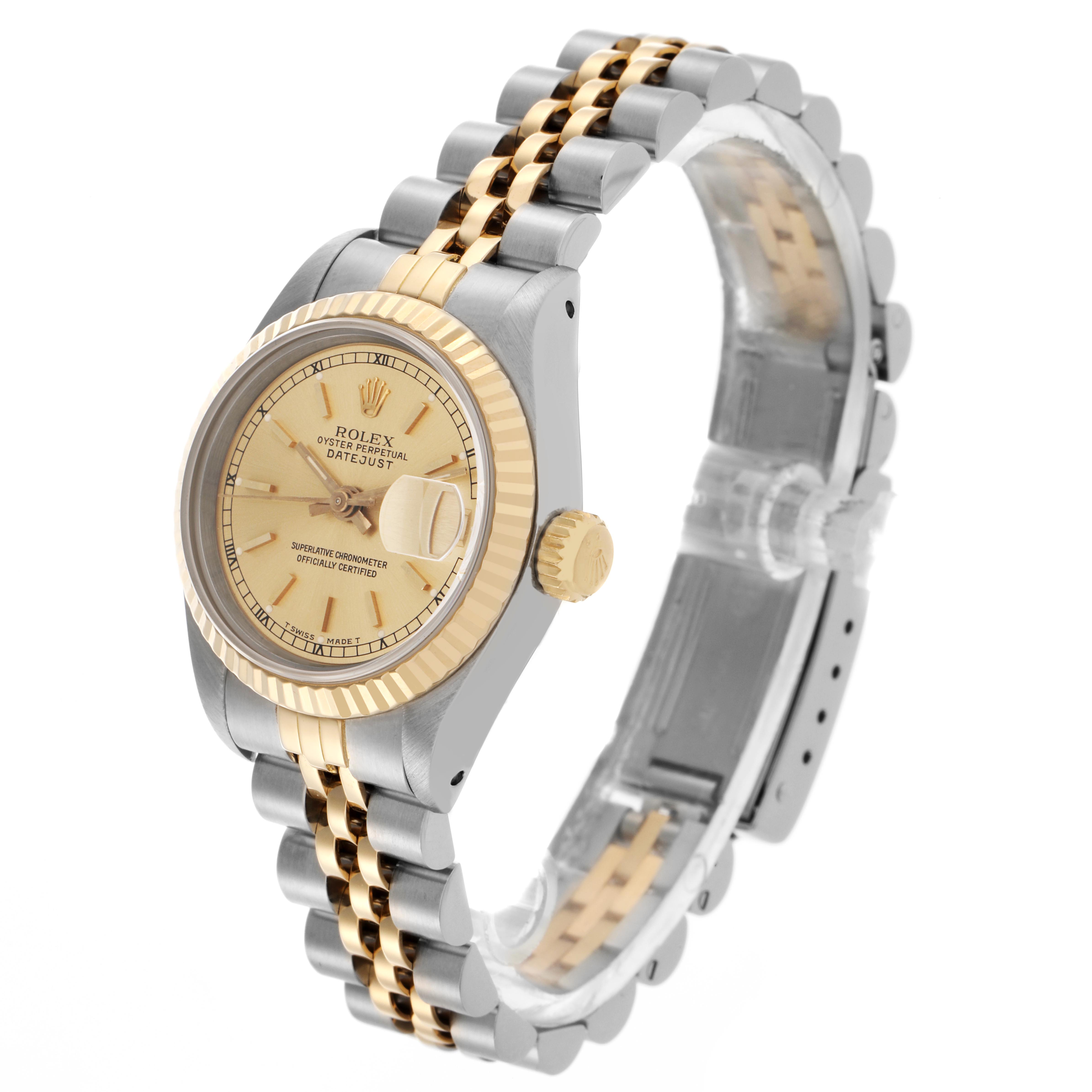 The Rolex Datejust 69173 Women
s Steel and Gold (two tone) Champagne Dial 69173 Women
s Steel and Gold (two tone) Champagne Dial watch is shown at an angle highlighting its face, bezel, crown, and two-tone bracelet.