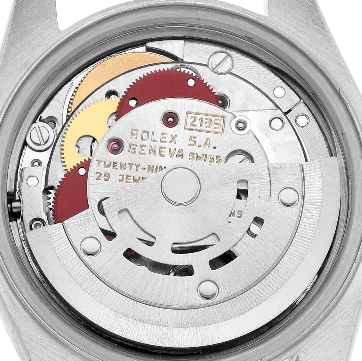The image shows the movement mechanism of a Rolex Datejust 69173 Women
s Steel and Gold (two tone) Champagne Dial 69173 Women
s Steel and Gold (two tone) Champagne Dial, highlighting gears and engravings inside the casing.