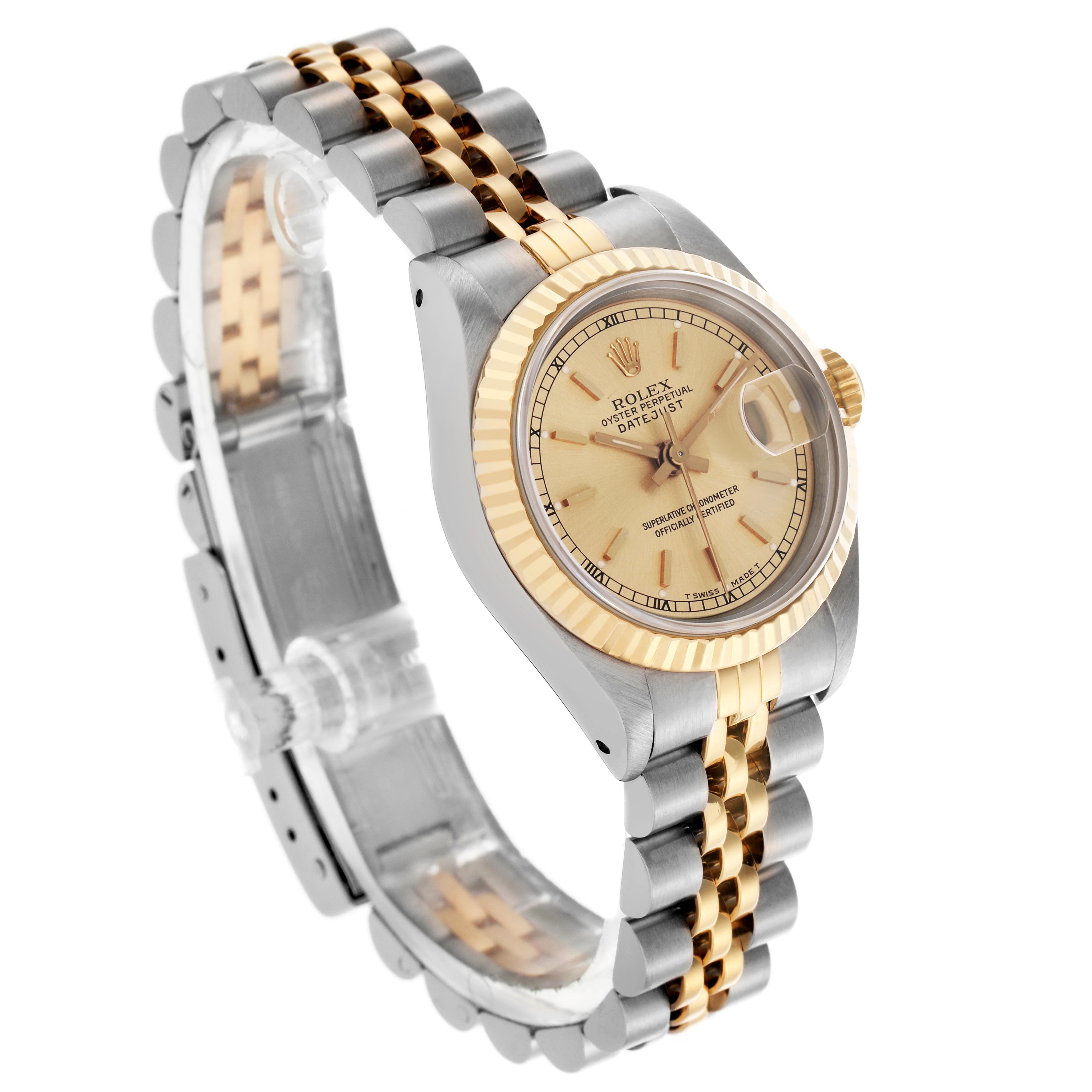 The image shows a Rolex Datejust 69173 Women
s Steel and Gold (two tone) Champagne Dial 69173 Women
s Steel and Gold (two tone) Champagne Dial watch at a three-quarter angle, highlighting its two-tone bracelet and fluted bezel.