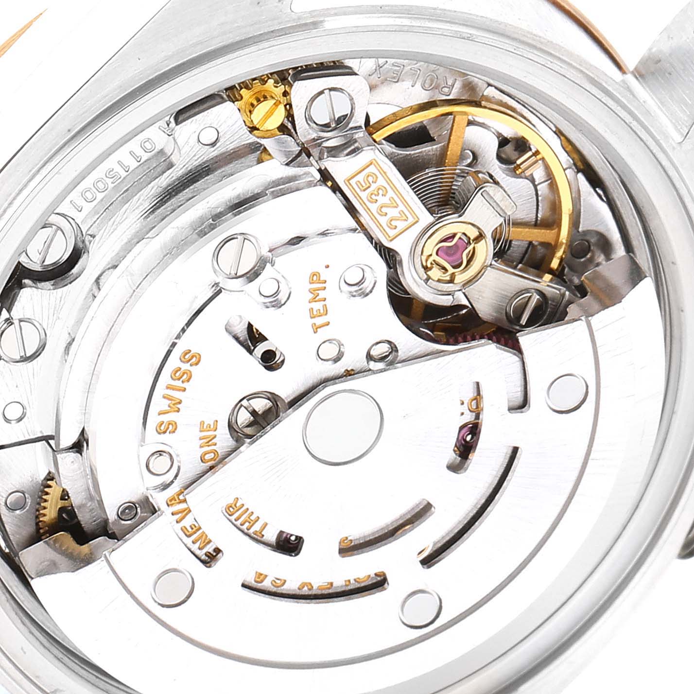The image shows the internal mechanisms of a Rolex Datejust 79163 Women's Steel and Gold (two tone) Mother of Pearl Dial 79163 Women's Steel and Gold (two tone) Mother of Pearl Dial watch viewed from the back, highlighting the intricate gears and components.