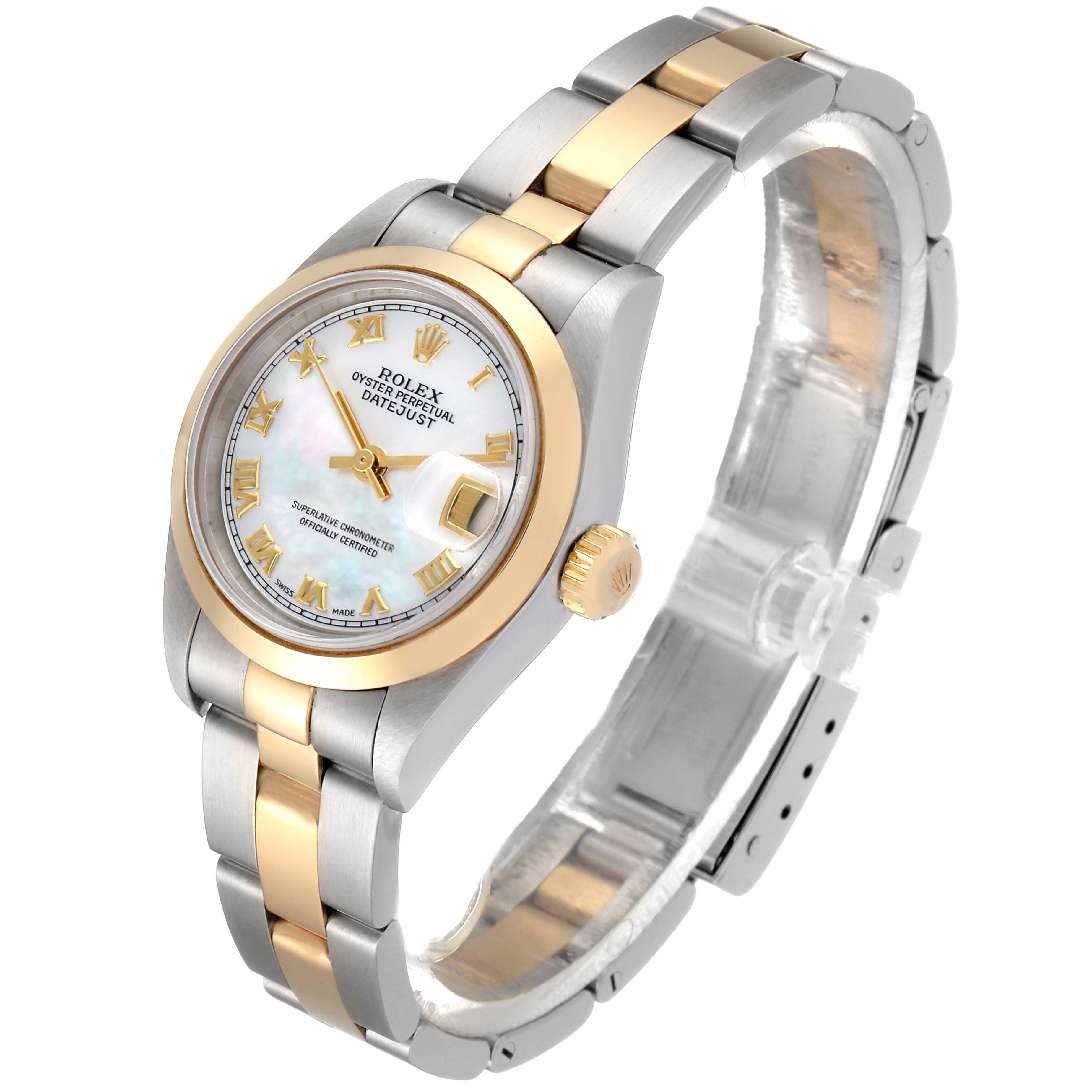 This image shows a Rolex Datejust 79163 Women's Steel and Gold (two tone) Mother of Pearl Dial 79163 Women's Steel and Gold (two tone) Mother of Pearl Dial watch, angled to display the dial, case, and bracelet from a side-tilted perspective.