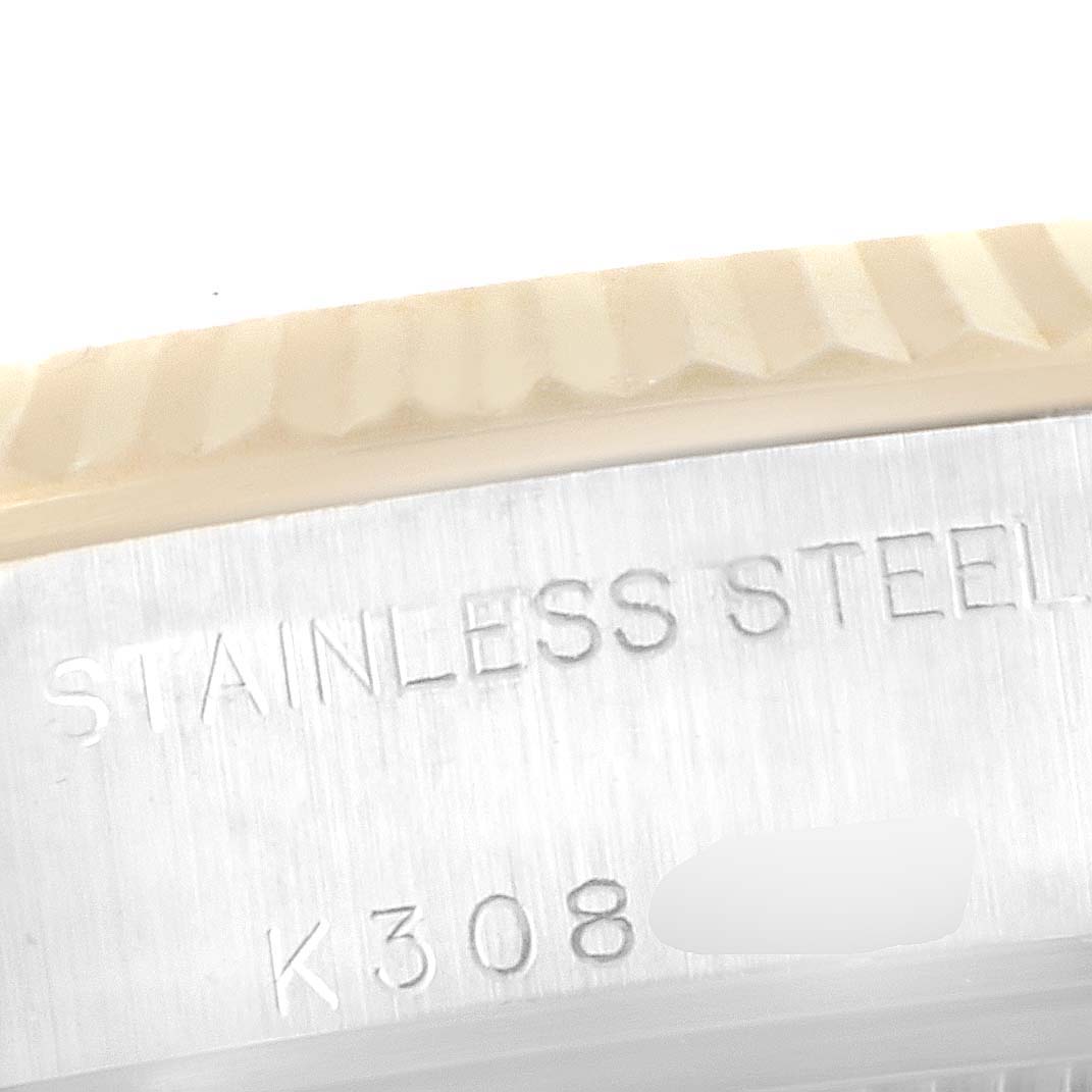 This image shows a close-up of the stainless steel case and fluted bezel of a Rolex Datejust 79173 Women
s Steel and Gold (two tone) Beige Dial 79173 Women
s Steel and Gold (two tone) Beige Dial watch.