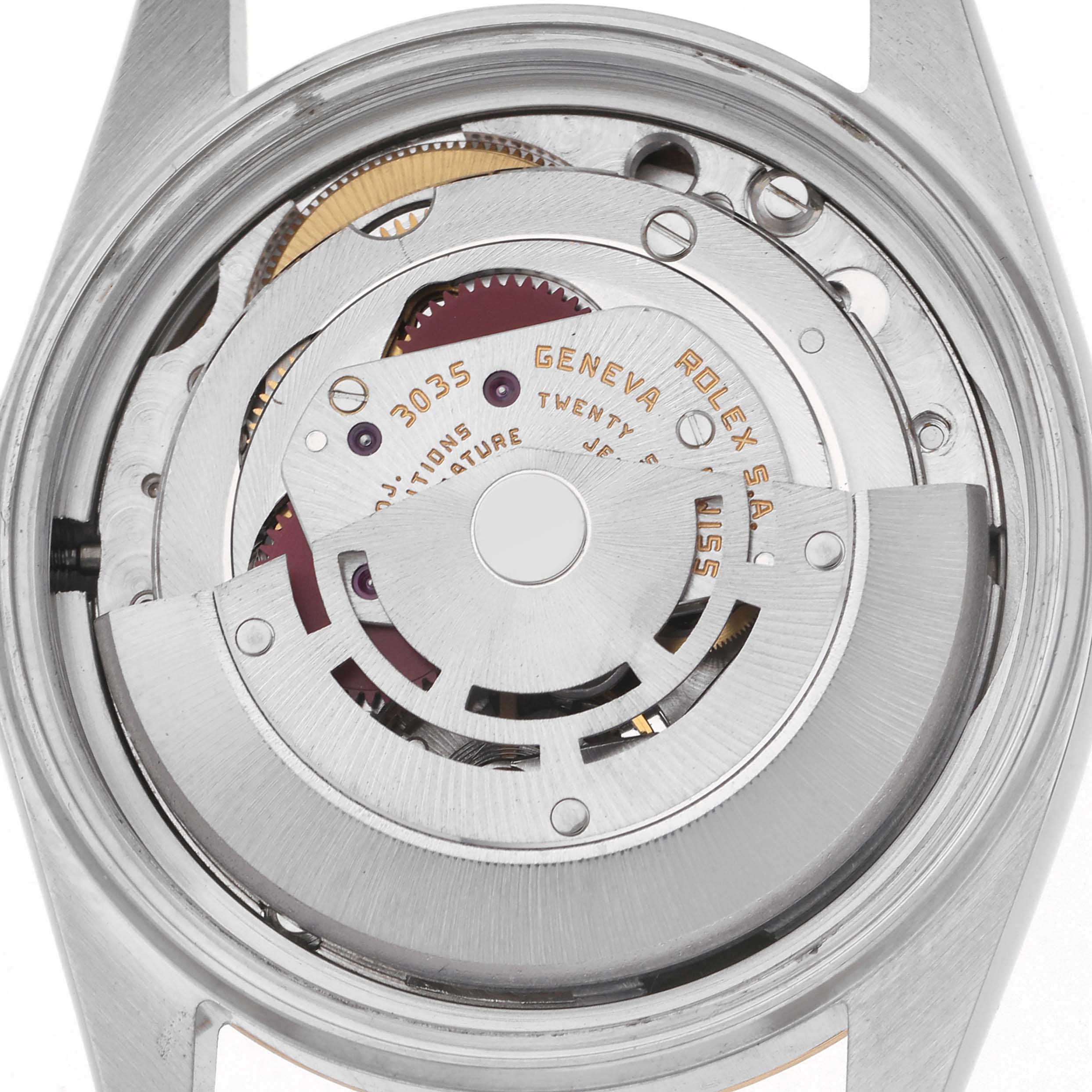 The image shows the movement inside the Rolex Datejust 16013 Men
s Steel and Gold (two tone) Champagne Dial 16013 Men
s Steel and Gold (two tone) Champagne Dial watch from a top-down angle, highlighting the rotor and gears.