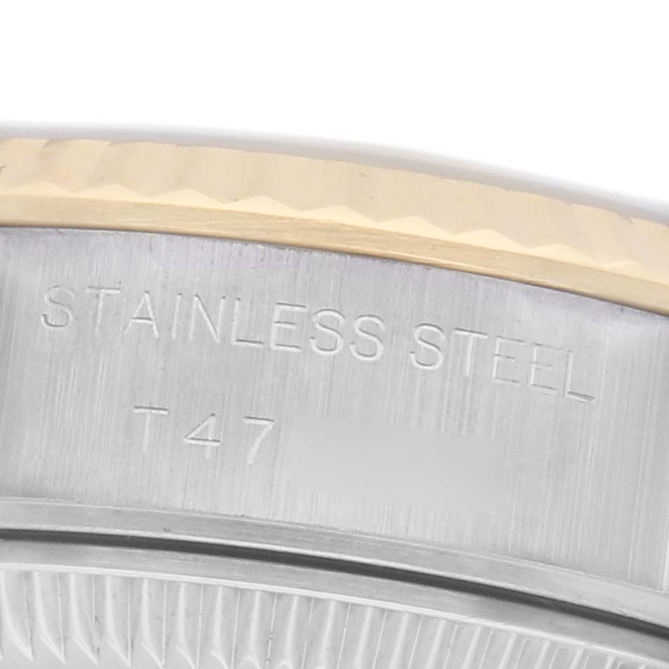 The image shows a close-up of the engraved side, featuring the stainless steel marking on a Rolex Datejust 69173 Women's Steel and Gold (two tone) White Dial 69173 Women's Steel and Gold (two tone) White Dial watch.