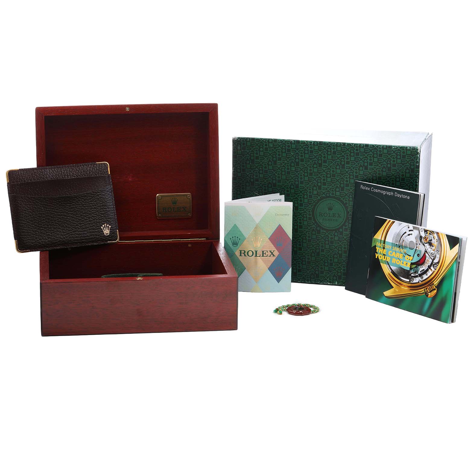 The image shows a Rolex Daytona 116519 Men's White Gold Silver Dial watch box with papers, a booklet, and a leather cardholder from a front angle.