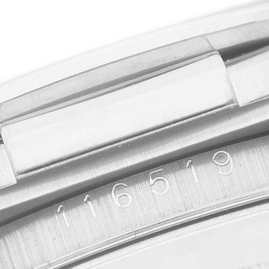 The image shows a close-up of the Rolex Daytona 116519 Men's White Gold Silver Dial model's case edge, highlighting part of the serial number.