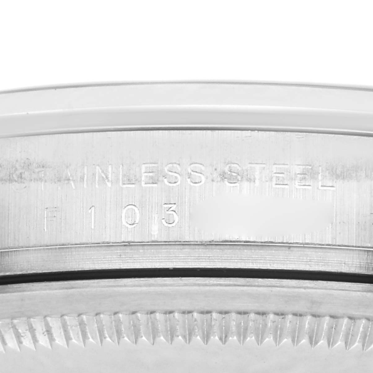 The image shows a close-up side view of the Rolex Explorer 114270 Men
s Stainless Steel Black Dial 114270 Men
s Stainless Steel Black Dial
s stainless steel case, highlighting the engraved serial number and edge details.