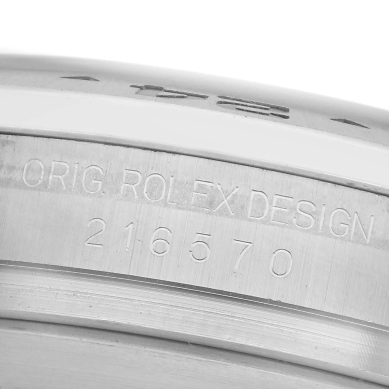 The image shows a close-up of the case side of a Rolex Explorer 216570 Men
s Stainless Steel White Dial 216570 Men
s Stainless Steel White Dial, highlighting the engraved model number "216570."
