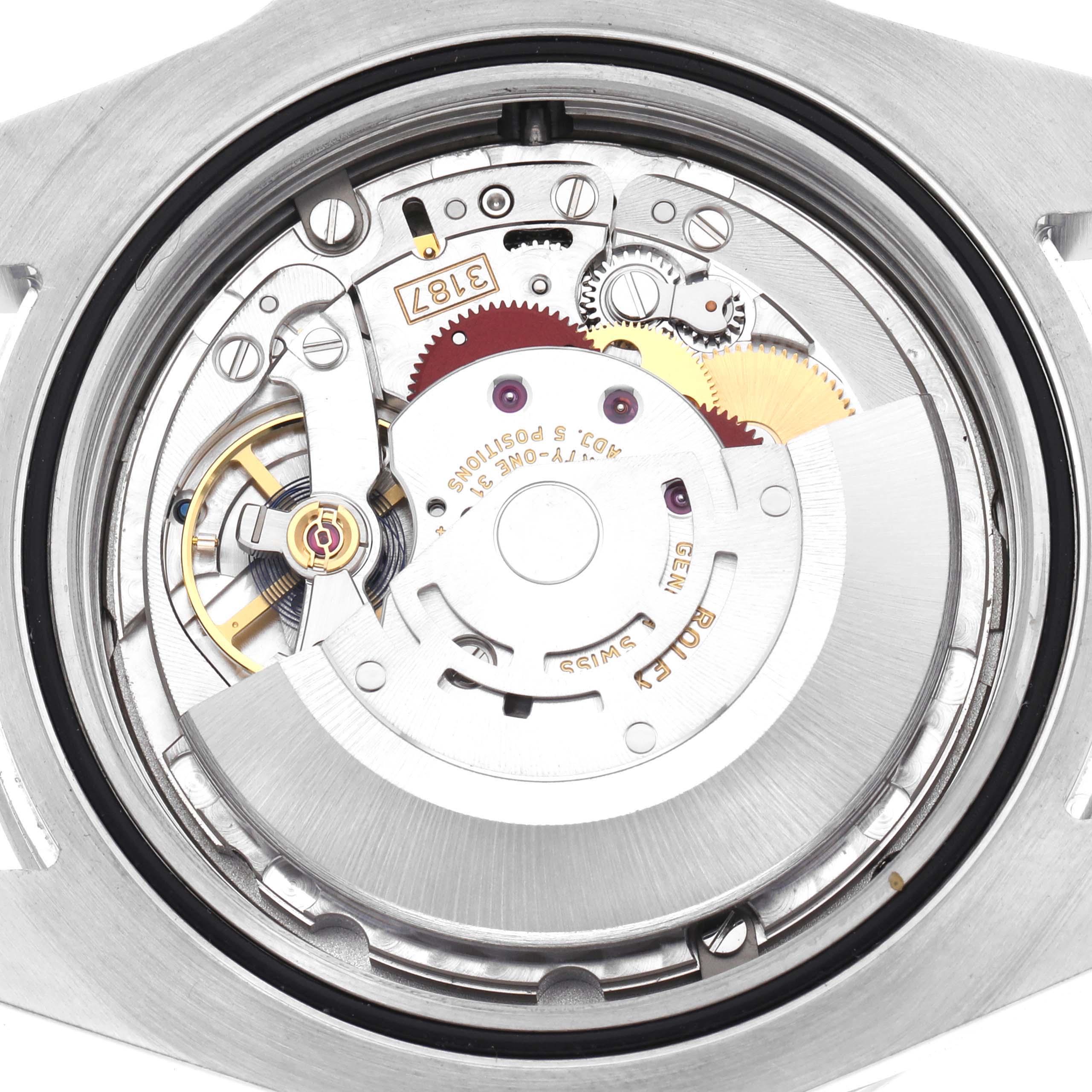 The image shows an interior view of the Rolex Explorer 216570 Men
s Stainless Steel White Dial 216570 Men
s Stainless Steel White Dial watch, focusing on the movement and gears from the back angle.