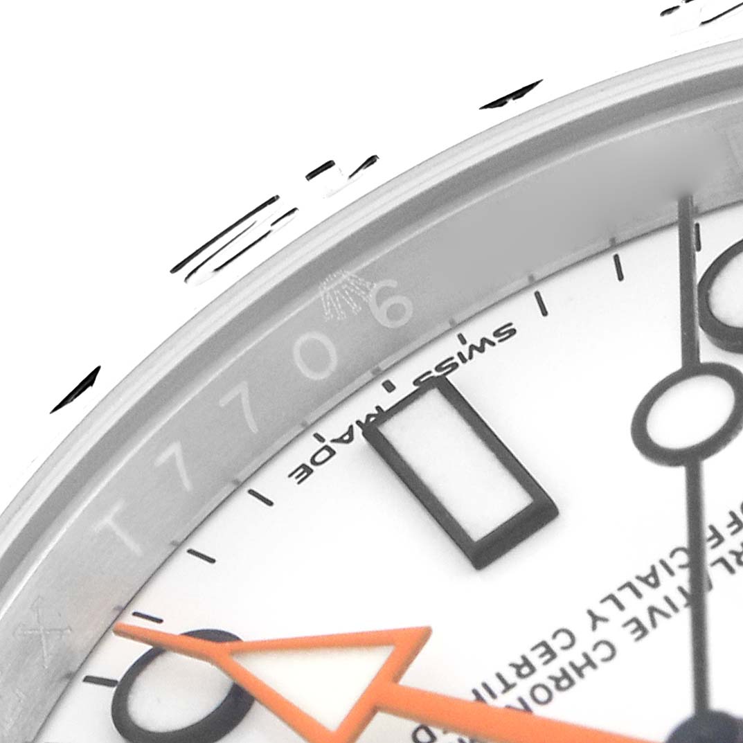 The image shows a close-up of the dial and part of the bezel on a Rolex Explorer 216570 Men
s Stainless Steel White Dial 216570 Men
s Stainless Steel White Dial, highlighting the hands and markings.