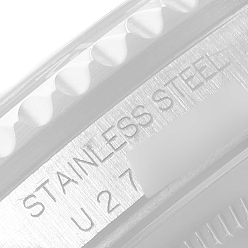 The image shows a close-up of the case side and bezel edge of a Rolex GMT-Master 16700 Men's Stainless Steel Black Dial 16700 Men's Stainless Steel Black Dial watch, with "STAINLESS STEEL" and part of the serial number visible.