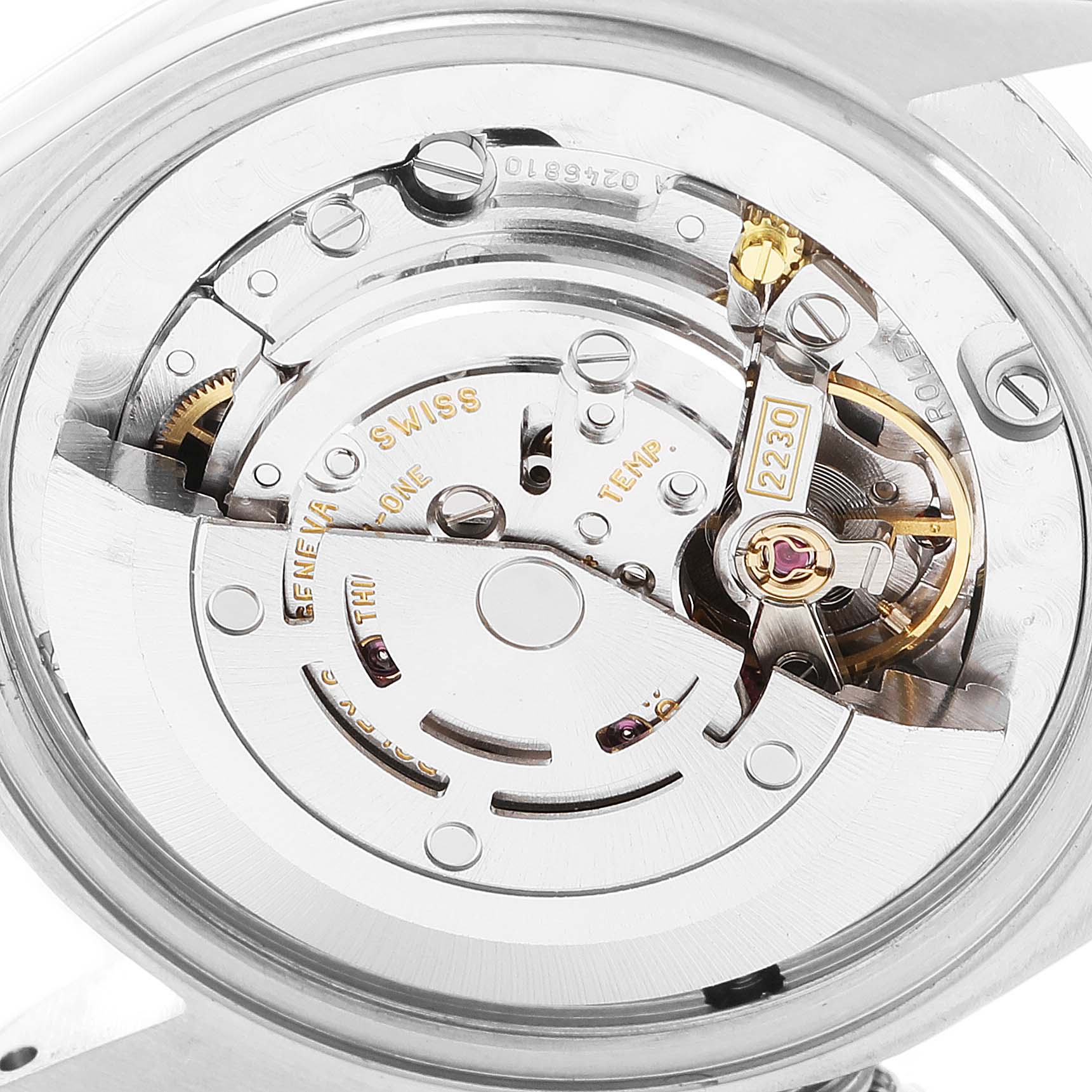 This image shows a close-up of the movement mechanism of a Rolex Mid-Size 77080 Women
s Stainless Steel Black Dial 77080 Women
s Stainless Steel Black Dial watch from a back angle.