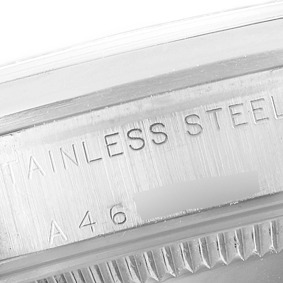 The image shows the engraved model and material detail on the side of a stainless steel Rolex Mid-Size 77080 Women
s Stainless Steel Black Dial 77080 Women
s Stainless Steel Black Dial watch case.