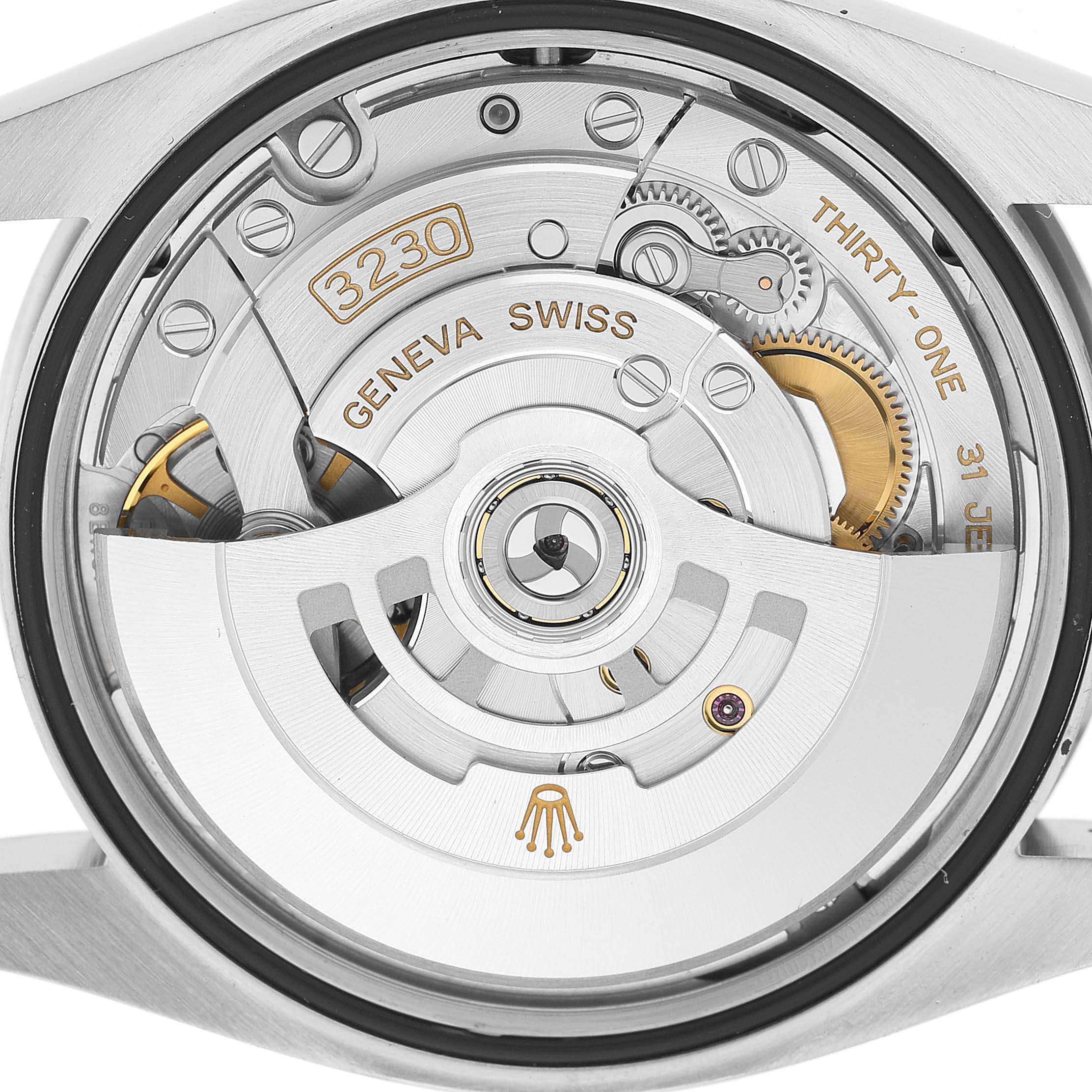 The image shows the back view of a Rolex Oyster Perpetual 126000 Men's Stainless Steel Pink Dial watch, displaying its automatic movement and rotor.