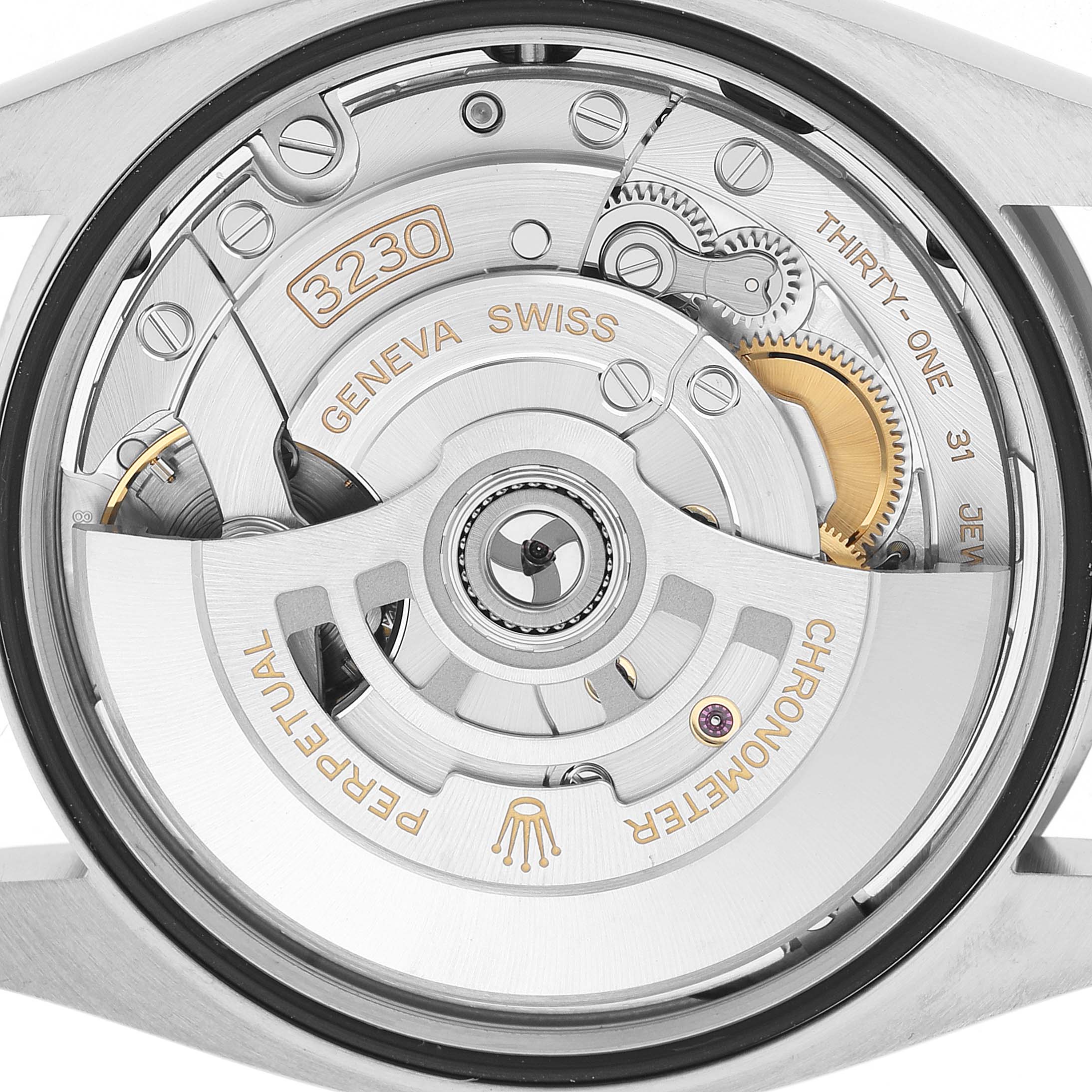 The image shows the movement of a Rolex Oyster Perpetual 126000 Men's Stainless Steel Pink Dial watch, focusing on the intricate internal mechanism and rotor.