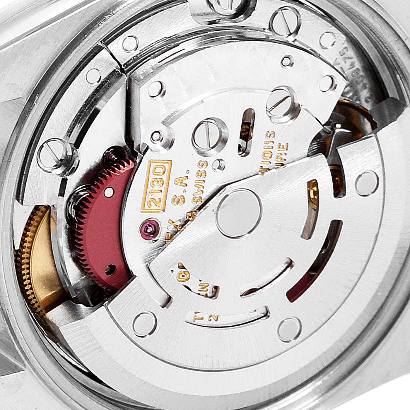 This is a close-up view of the movement inside a Rolex Oyster Perpetual 67230 Women's Stainless Steel Pink Dial 67230 Women's Stainless Steel Pink Dial watch, highlighting the intricate mechanical components.