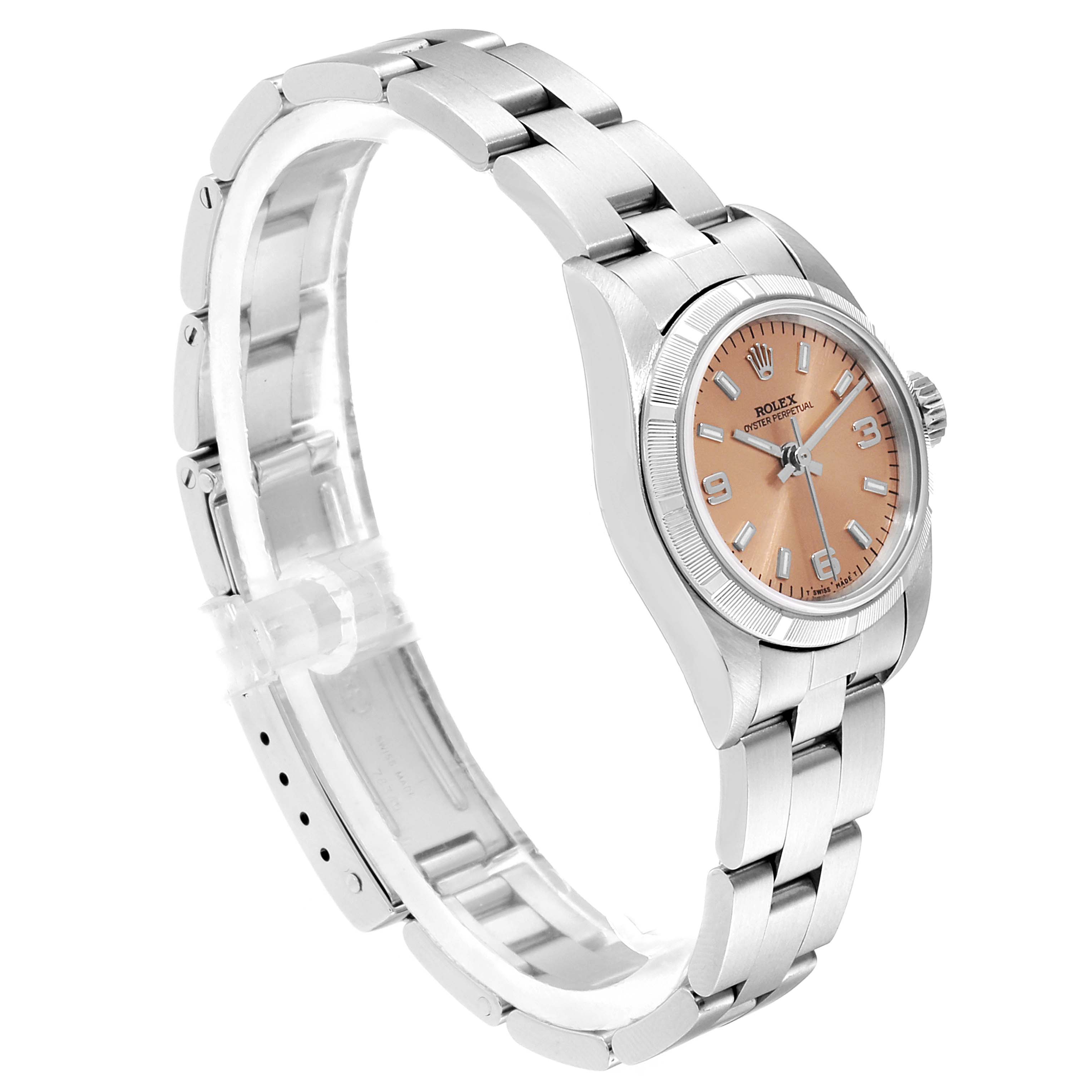 The Rolex Oyster Perpetual 67230 Women's Stainless Steel Pink Dial 67230 Women's Stainless Steel Pink Dial watch is shown from a slight side angle, displaying its bracelet, case, dial, and crown.