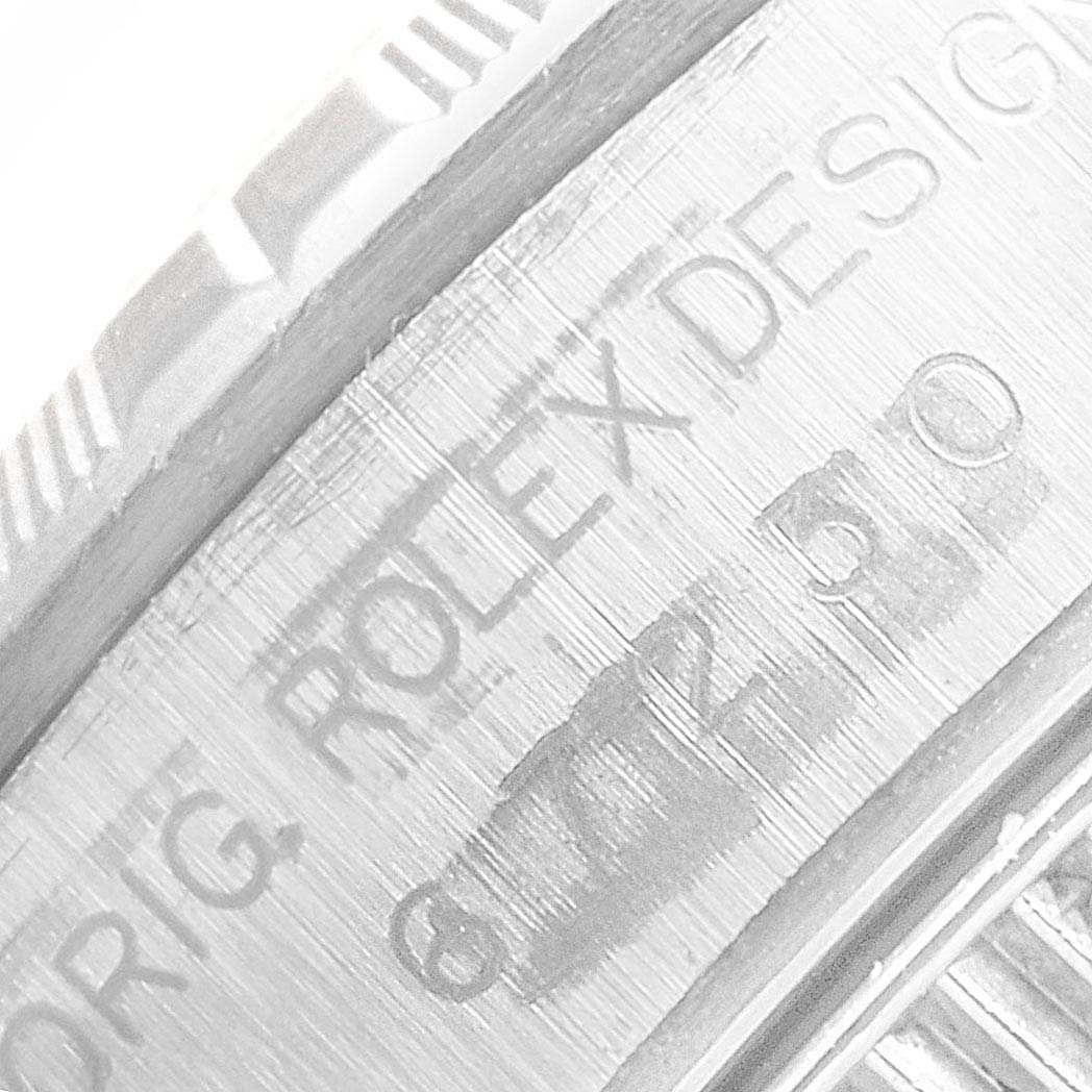 This image shows a close-up angle of the engraving on a Rolex Oyster Perpetual 67230 Women's Stainless Steel Pink Dial 67230 Women's Stainless Steel Pink Dial watch case. 