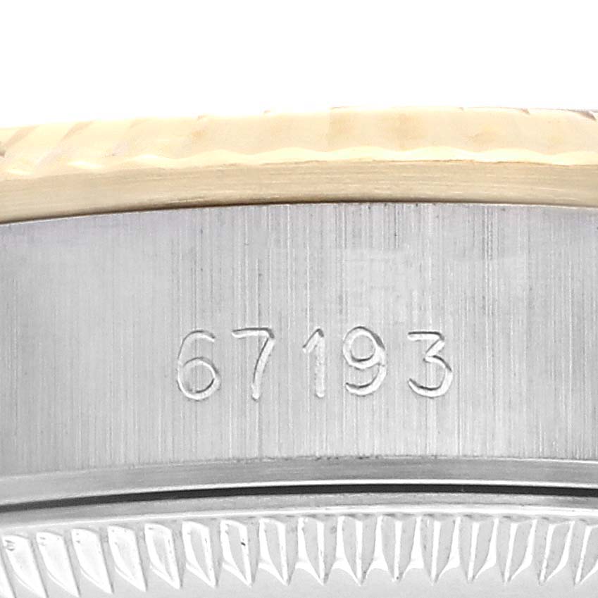 The image shows the side view of the case of a Rolex Oyster Perpetual 67193 Women
s Steel and Gold (two tone) Champagne Dial 67193 Women
s Steel and Gold (two tone) Champagne Dial watch, displaying the model number "67193."