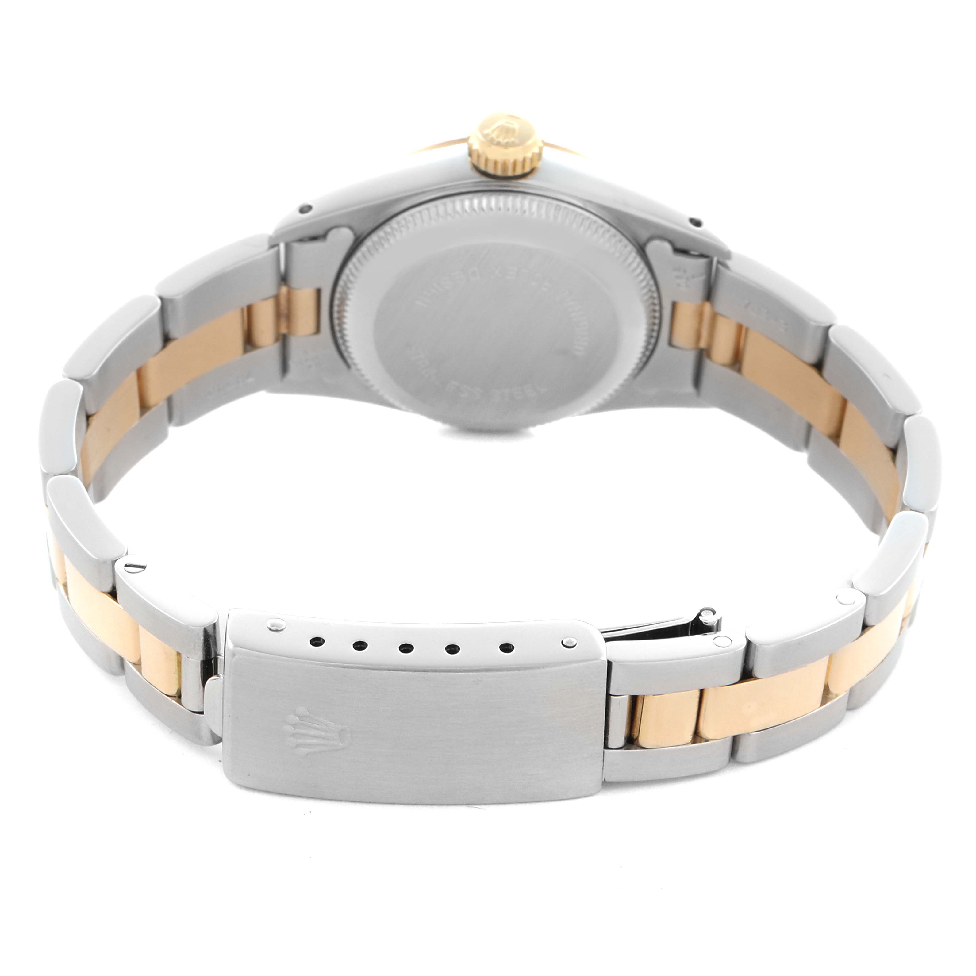 The image shows the back view of a Rolex Oyster Perpetual 67193 Women
s Steel and Gold (two tone) Champagne Dial 67193 Women
s Steel and Gold (two tone) Champagne Dial watch, highlighting the clasp and bracelet links.
