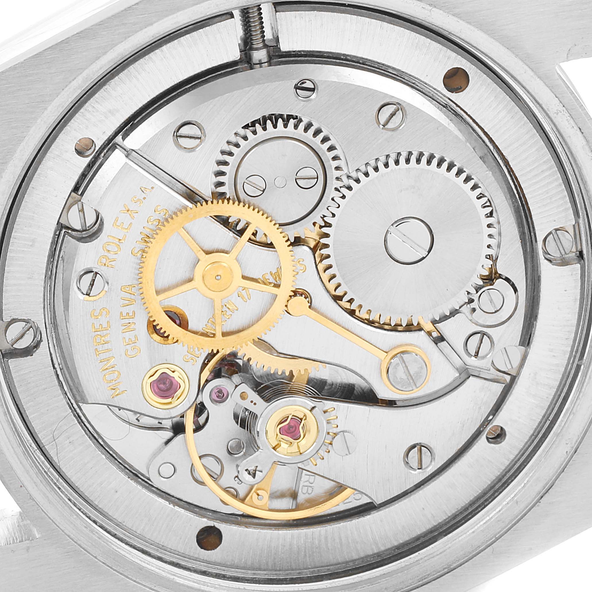 The image shows a close-up of the internal movement and gears of a Rolex Date 6694 Men's Stainless Steel Silver Dial 6694 Men's Stainless Steel Silver Dial model watch.