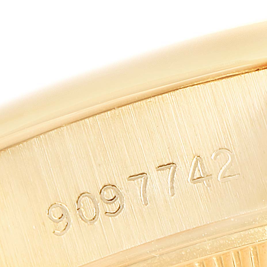This close-up image shows the serial number engraving on the case side of a Rolex President 69138 Women
s Yellow Gold Champagne Dial 69138 Women
s Yellow Gold Champagne Dial model watch.