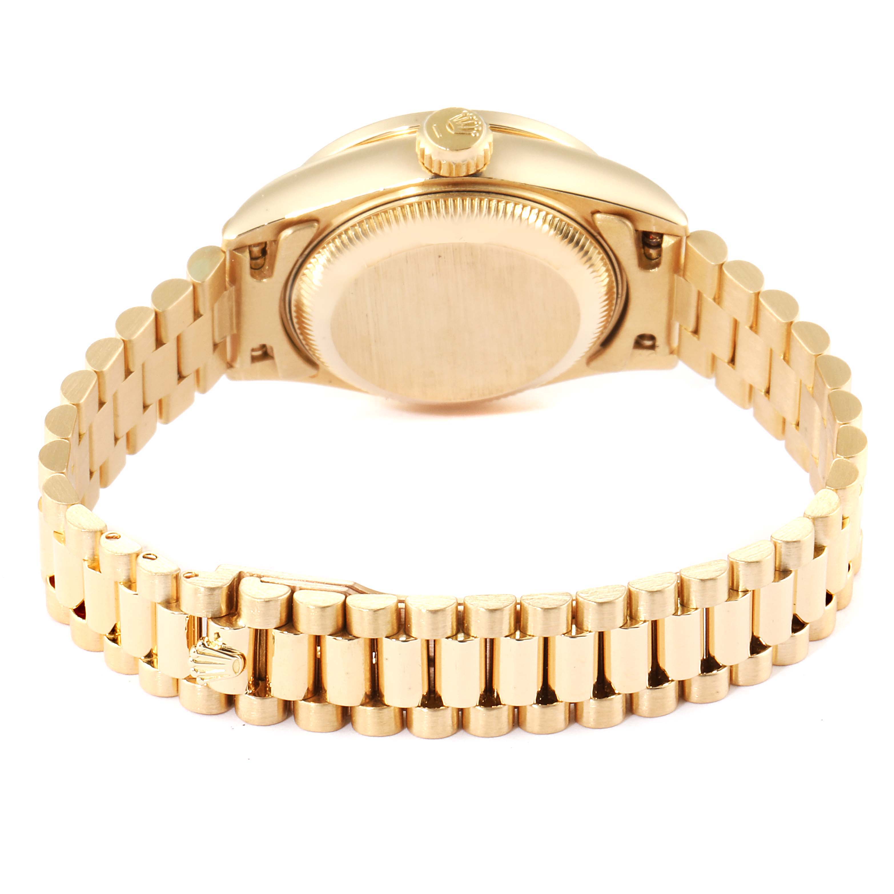 The image shows the back and bracelet of a Rolex President 69138 Women
s Yellow Gold Champagne Dial 69138 Women
s Yellow Gold Champagne Dial model watch at an angle emphasizing the case back and crown.