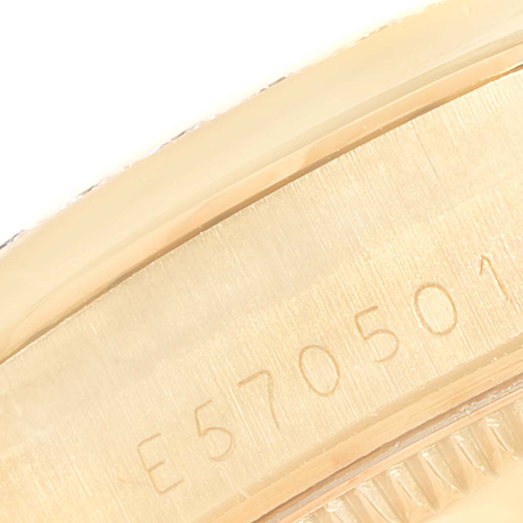 This image shows a close-up of the serial number on the side of a Rolex President 68288 Women
s Yellow Gold Champagne Dial 68288 Women
s Yellow Gold Champagne Dial model watch.
