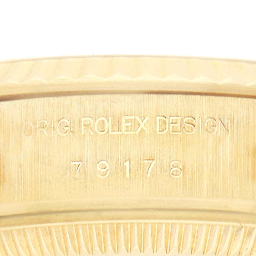 The image shows a close-up of the casing edge on the Rolex President 79178 Women
s Yellow Gold Champagne Dial 79178 Women
s Yellow Gold Champagne Dial watch, highlighting the model number engraving.