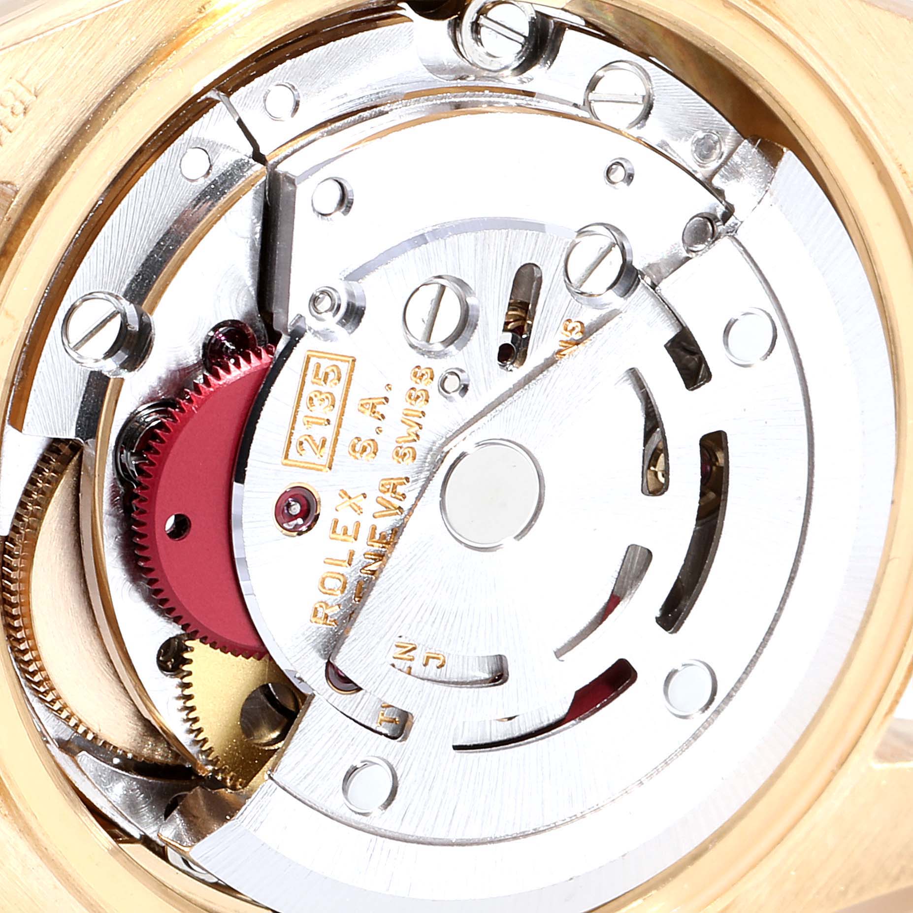 This is a close-up view of the movement inside the Rolex President 69178 Women
s Yellow Gold Champagne Dial 69178 Women
s Yellow Gold Champagne Dial watch, showcasing its intricate mechanical parts.