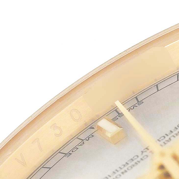 The image shows the edge of the dial and part of the bezel of a Rolex President 118388 Men's Yellow Gold Silver Dial watch at a close-up angle.
