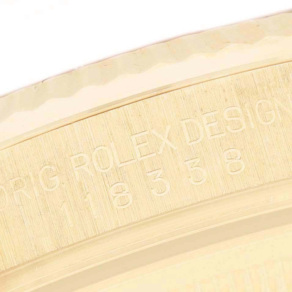 The image shows a close-up of the engraved bezel on a Rolex President 118388 Men's Yellow Gold Silver Dial model watch.