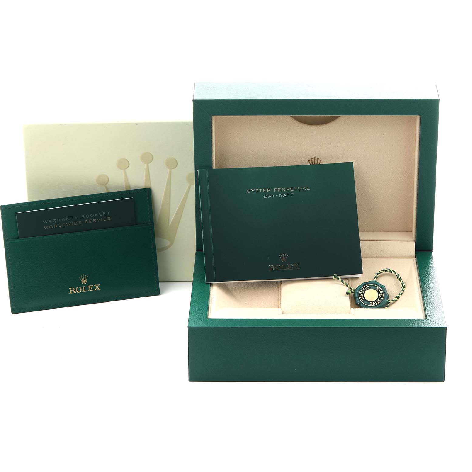 The image shows a Rolex President 118238 Men
s Yellow Gold White Dial 118238 Men
s Yellow Gold White Dial model box with a warranty booklet, instruction manual, and a green tag.