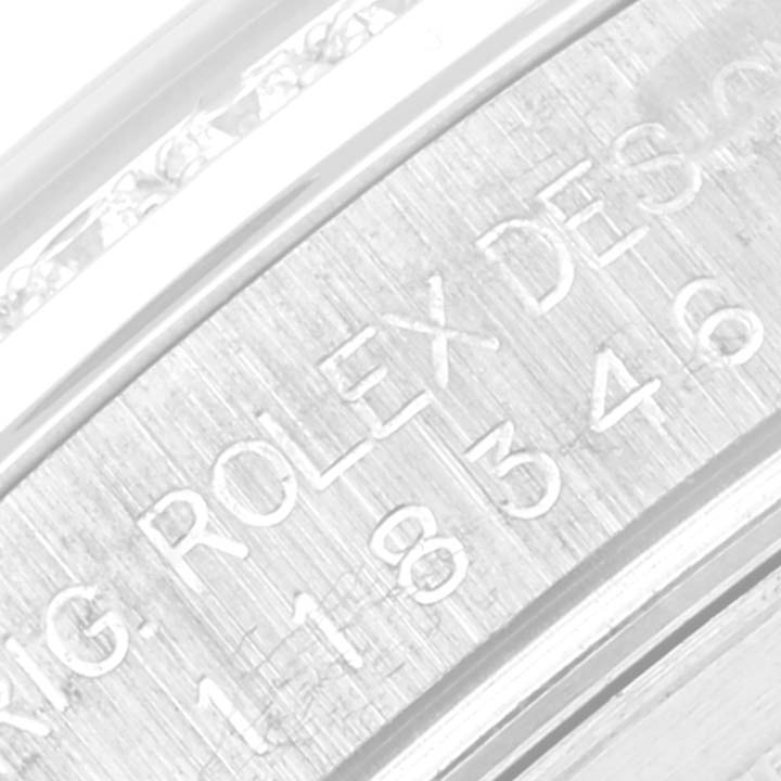 The image shows a close-up angle of the engraved details on the side of the Rolex President 118346 Men's Platinum Silver Dial 118346 Men's Platinum Silver Dial model watch.
