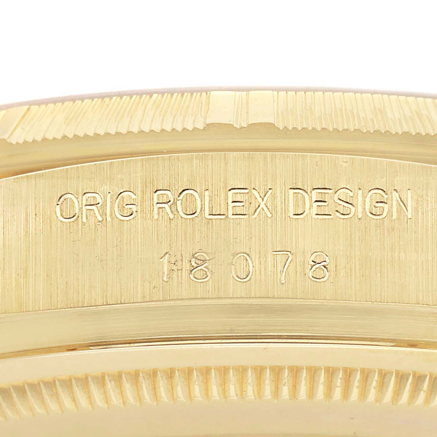 The image shows a close-up angle of the side of the Rolex President 18078 Men
s Yellow Gold Champagne Dial 18078 Men
s Yellow Gold Champagne Dial watch, highlighting its engraved model details.