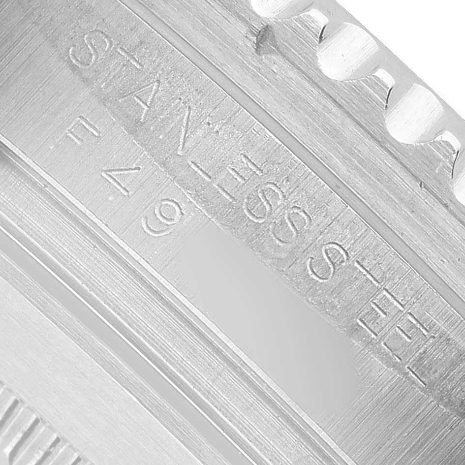 The image shows a close-up of the engraved markings on the inner bezel of a Rolex Sea-Dweller 16600 Men's Stainless Steel Black Dial watch.