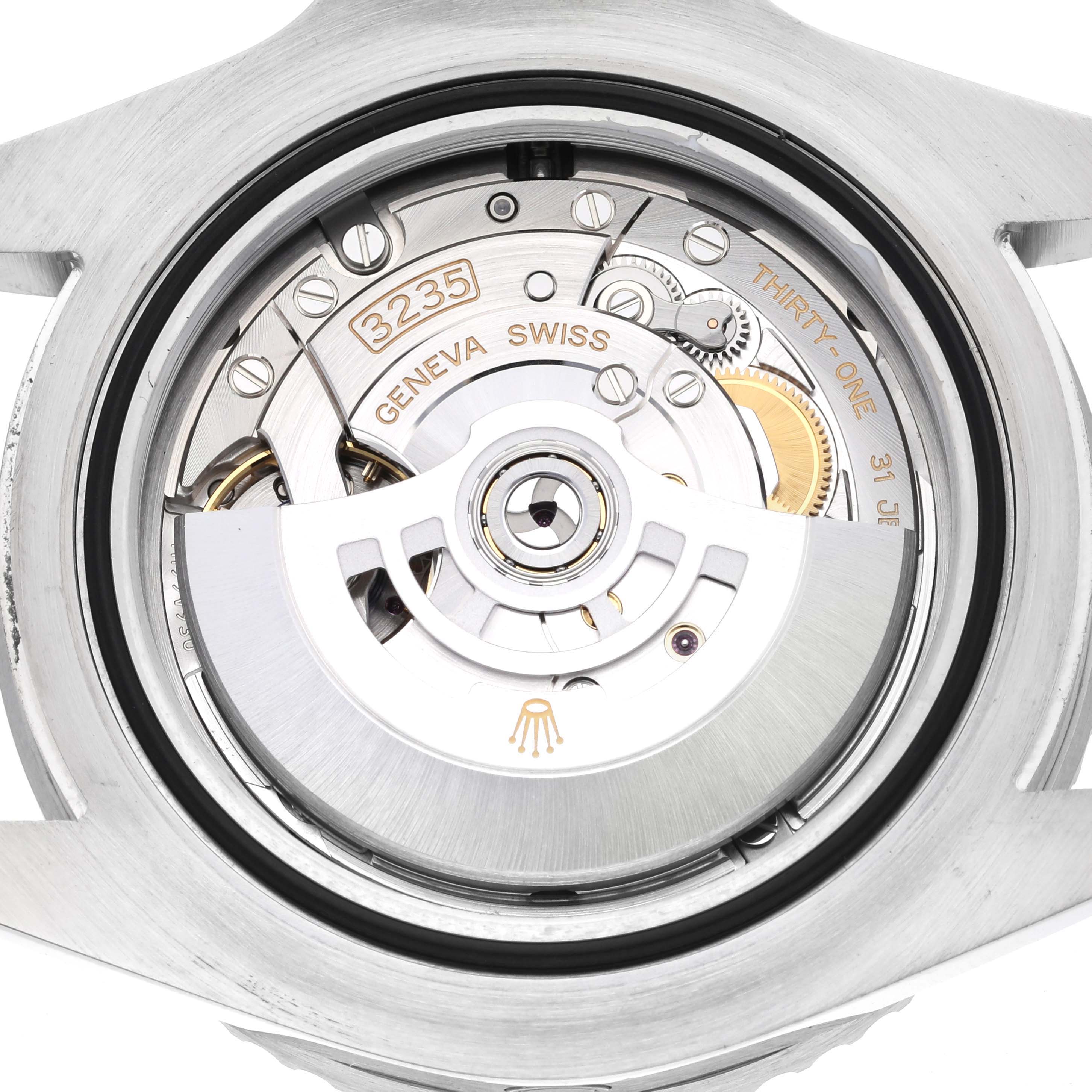 This image shows the back view of the Rolex Sea-Dweller 126600 Men
s Stainless Steel Black Dial 126600 Men
s Stainless Steel Black Dial, revealing its intricate movement and parts of its automatic winding mechanism.