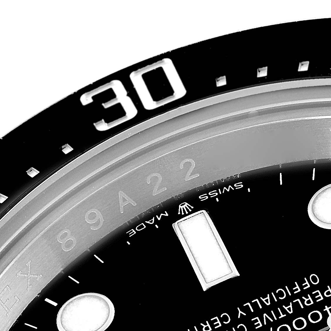 The image shows a close-up of the bezel and part of the dial of the Rolex Sea-Dweller 126600 Men
s Stainless Steel Black Dial 126600 Men
s Stainless Steel Black Dial watch, with a focus on the 30-minute marker.