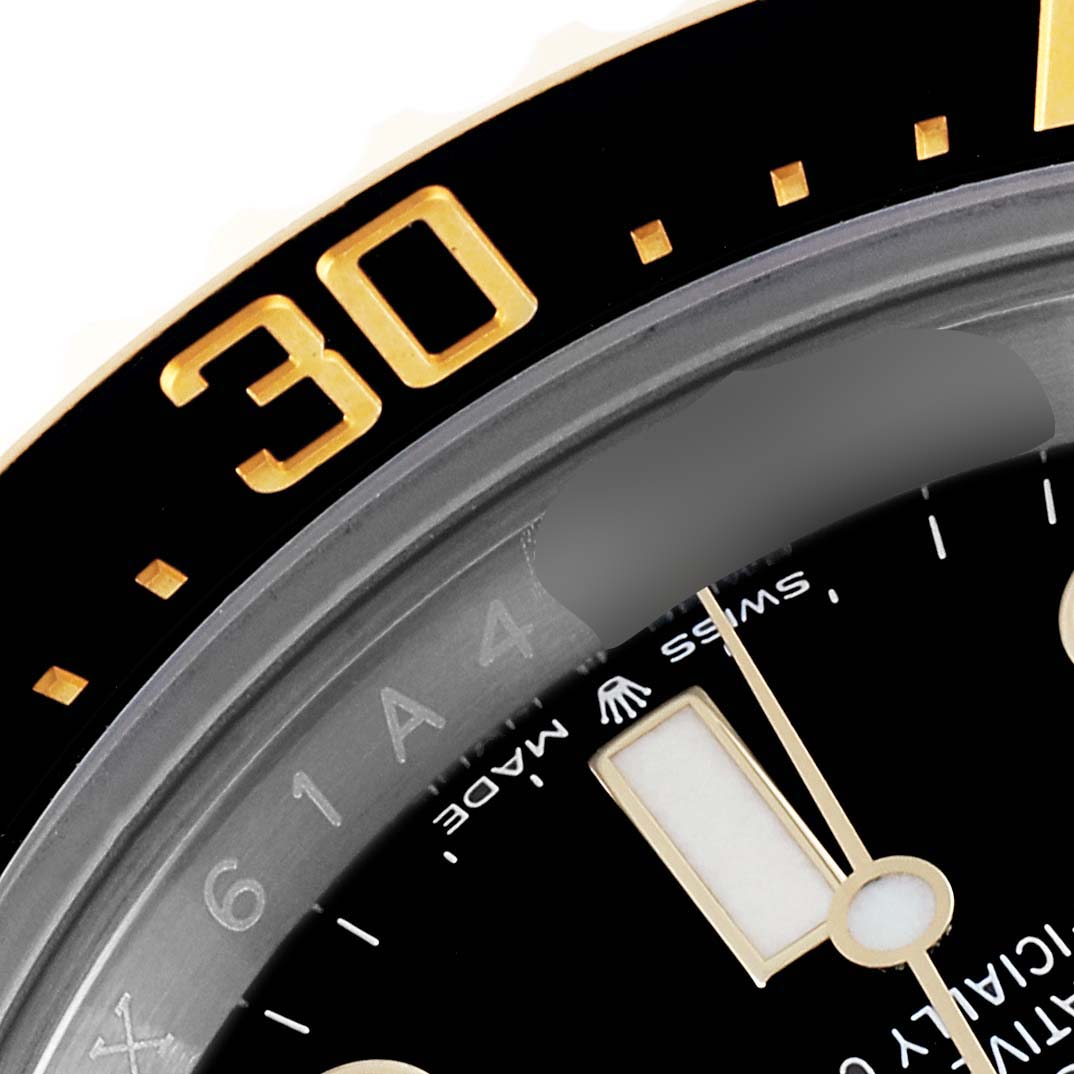 The image shows a close-up of the bezel and part of the dial of a Rolex Sea-Dweller 126603 Men's Steel and Gold (two tone) Black Dial 126603 Men's Steel and Gold (two tone) Black Dial watch.