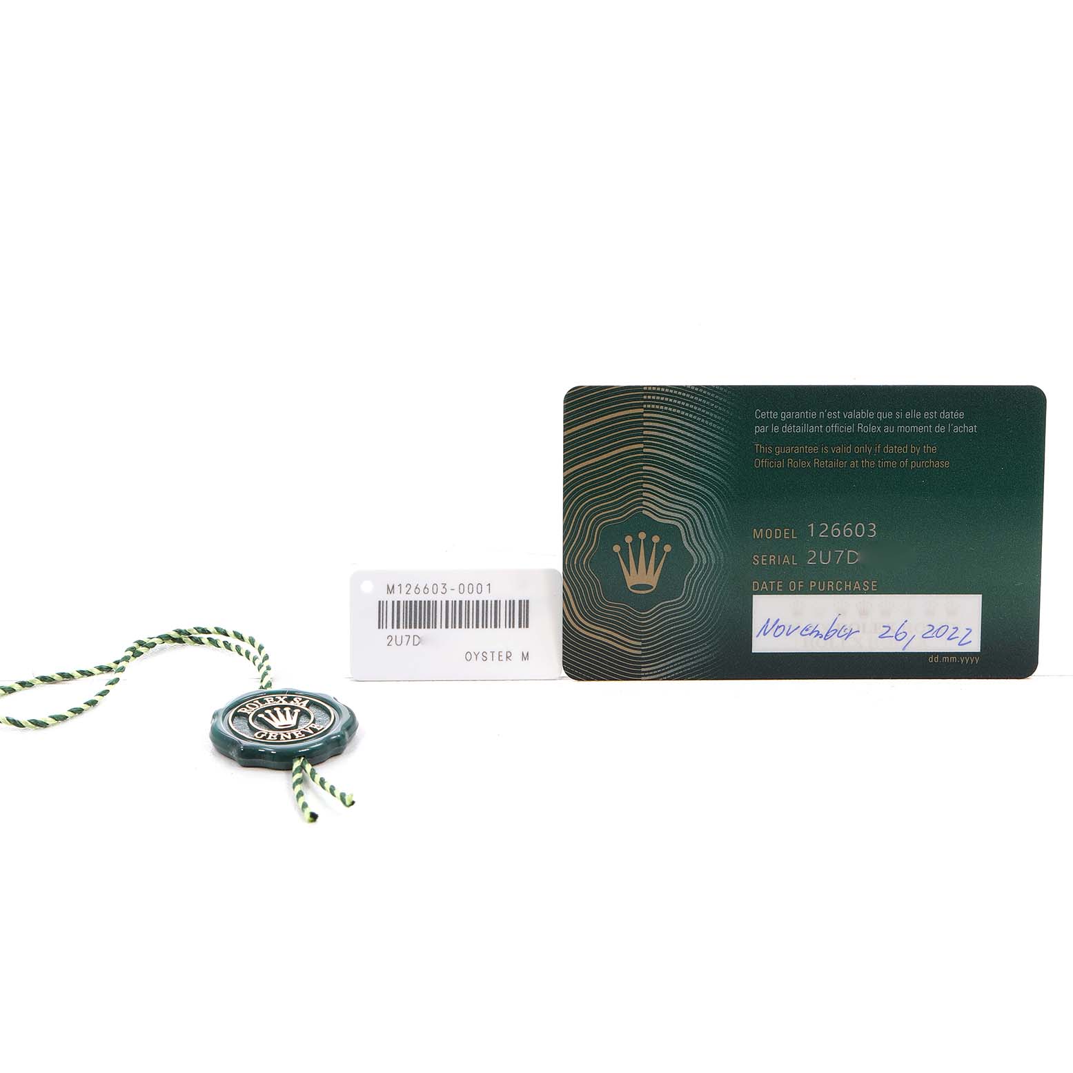 The image shows a Rolex Sea-Dweller 126603 Men's Steel and Gold (two tone) Black Dial model card, serial tag, and green hang tag accessories.