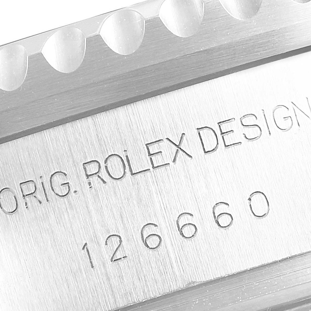 This image shows a close-up view of the outer edge and engraved serial number on the Sea-Dweller model by Rolex.
