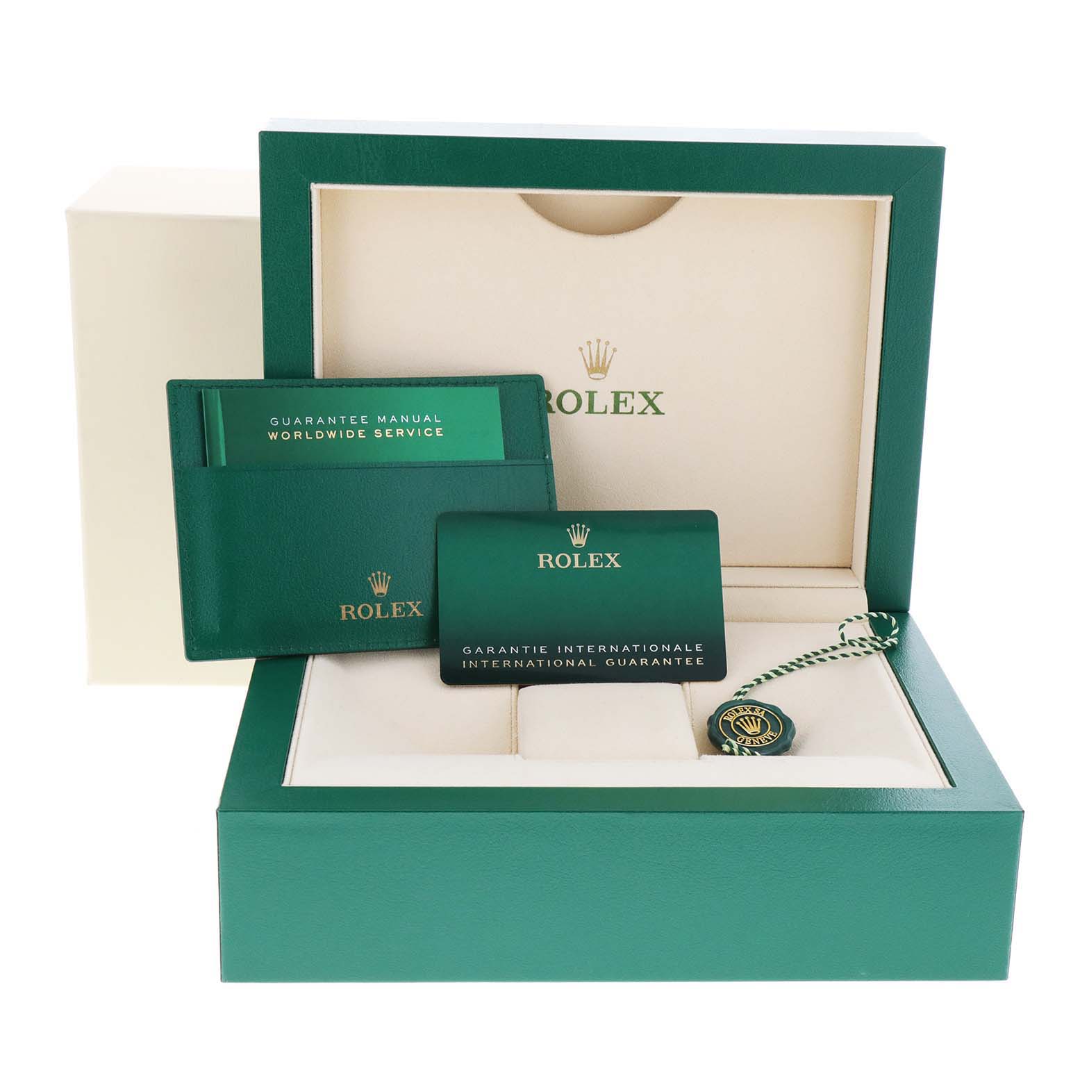 This image shows the box, international guarantee card, manual, and tag of a Rolex Sea-Dweller 126660 Men
s Stainless Steel Blue Dial 126660 Men
s Stainless Steel Blue Dial watch.