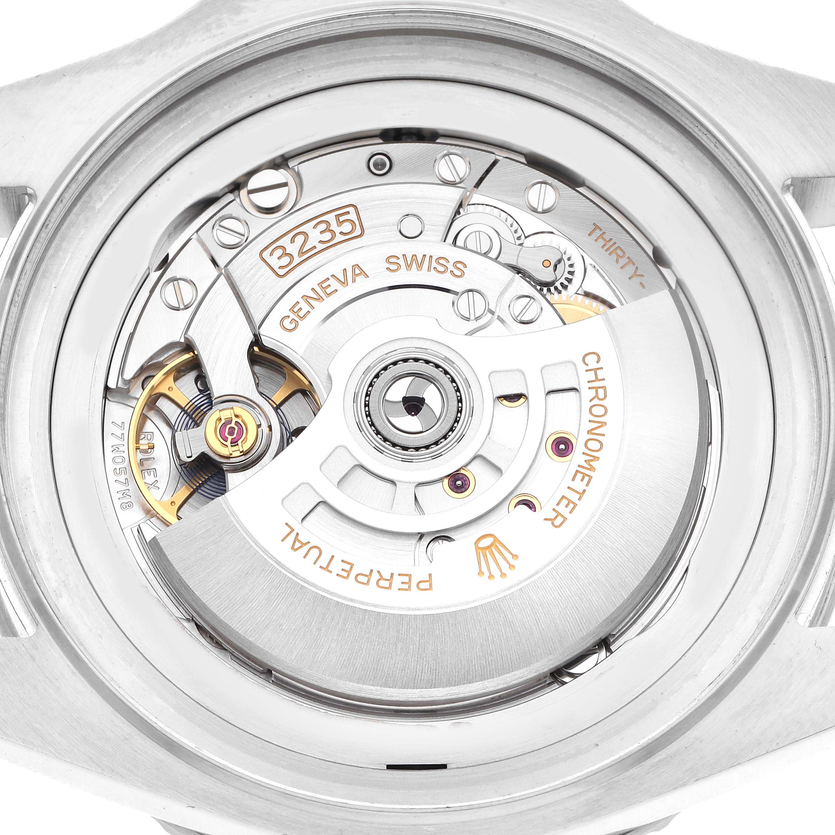 The image shows a close-up of the Rolex Sea-Dweller 136660 Men
s Stainless Steel Black Dial 136660 Men
s Stainless Steel Black Dial
s movement, highlighting its intricate gears and rotor.