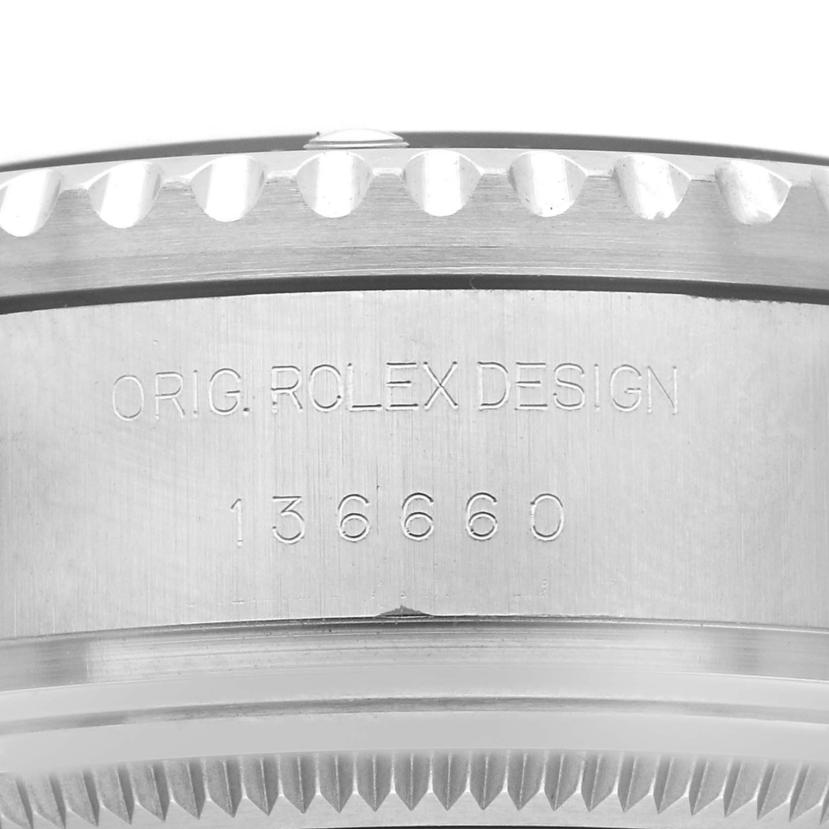 The image shows the side casing of a Rolex Sea-Dweller 136660 Men
s Stainless Steel Black Dial 136660 Men
s Stainless Steel Black Dial watch, featuring the engraved design and reference number.