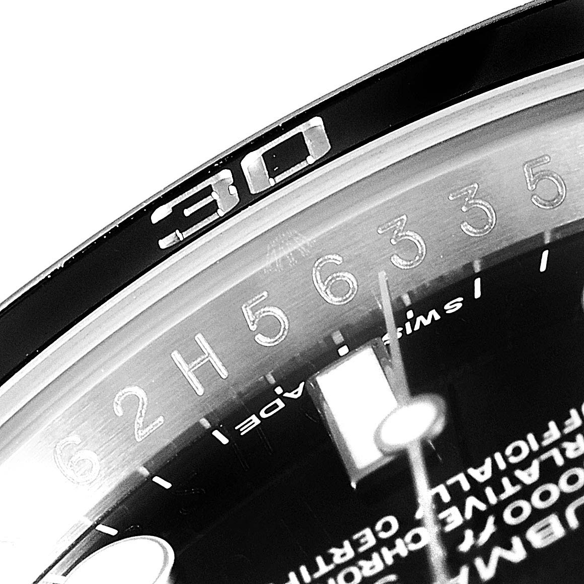 The image shows a close-up of the 30-minute marker on the bezel and part of the dial of a Rolex Submariner 116610 Men
s Stainless Steel Black Dial 116610 Men
s Stainless Steel Black Dial.