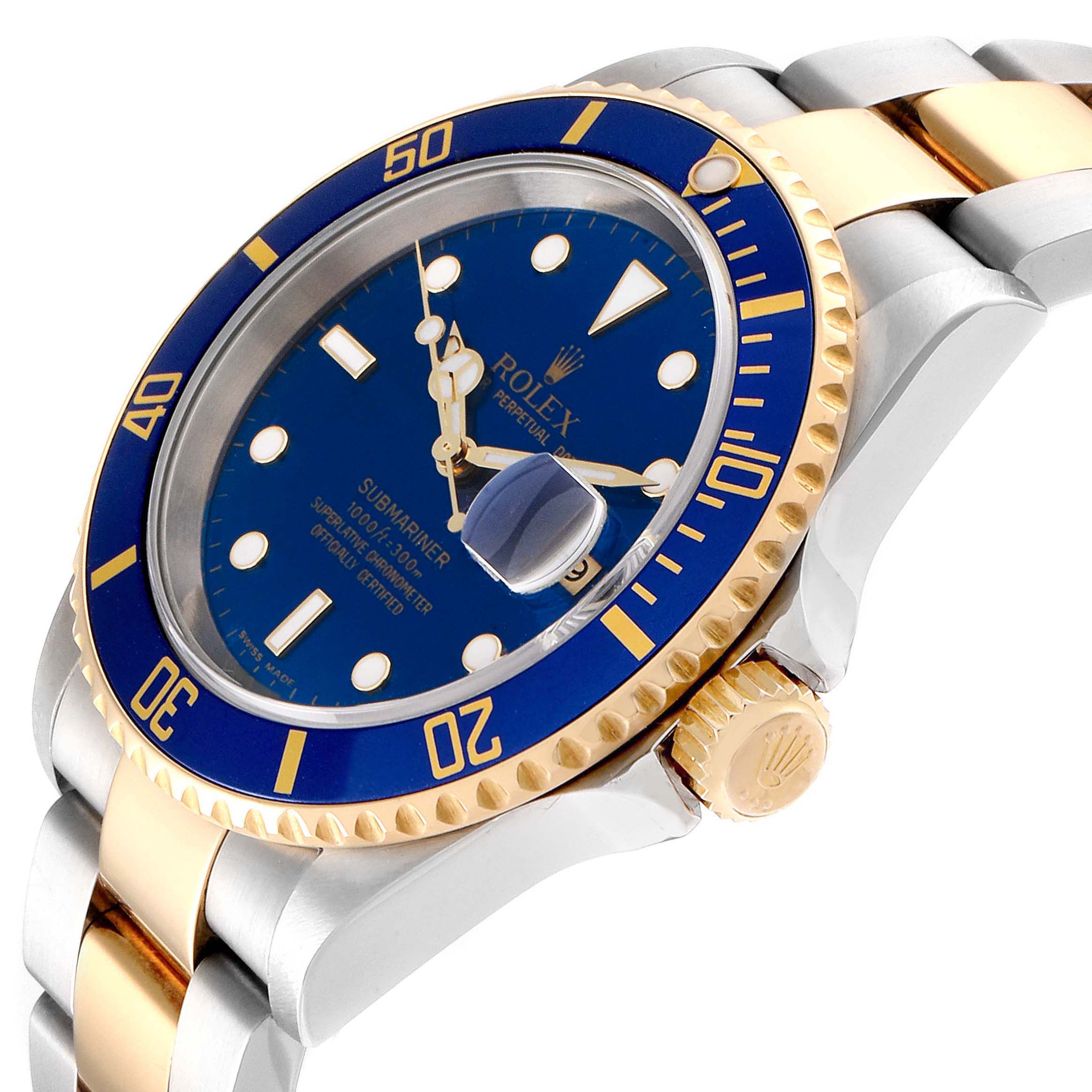The Rolex Submariner 16613 Men
s Steel and Gold (two tone) Blue Dial 16613 Men
s Steel and Gold (two tone) Blue Dial watch is shown at a slight angle highlighting its blue dial, bezel, and two-tone bracelet.