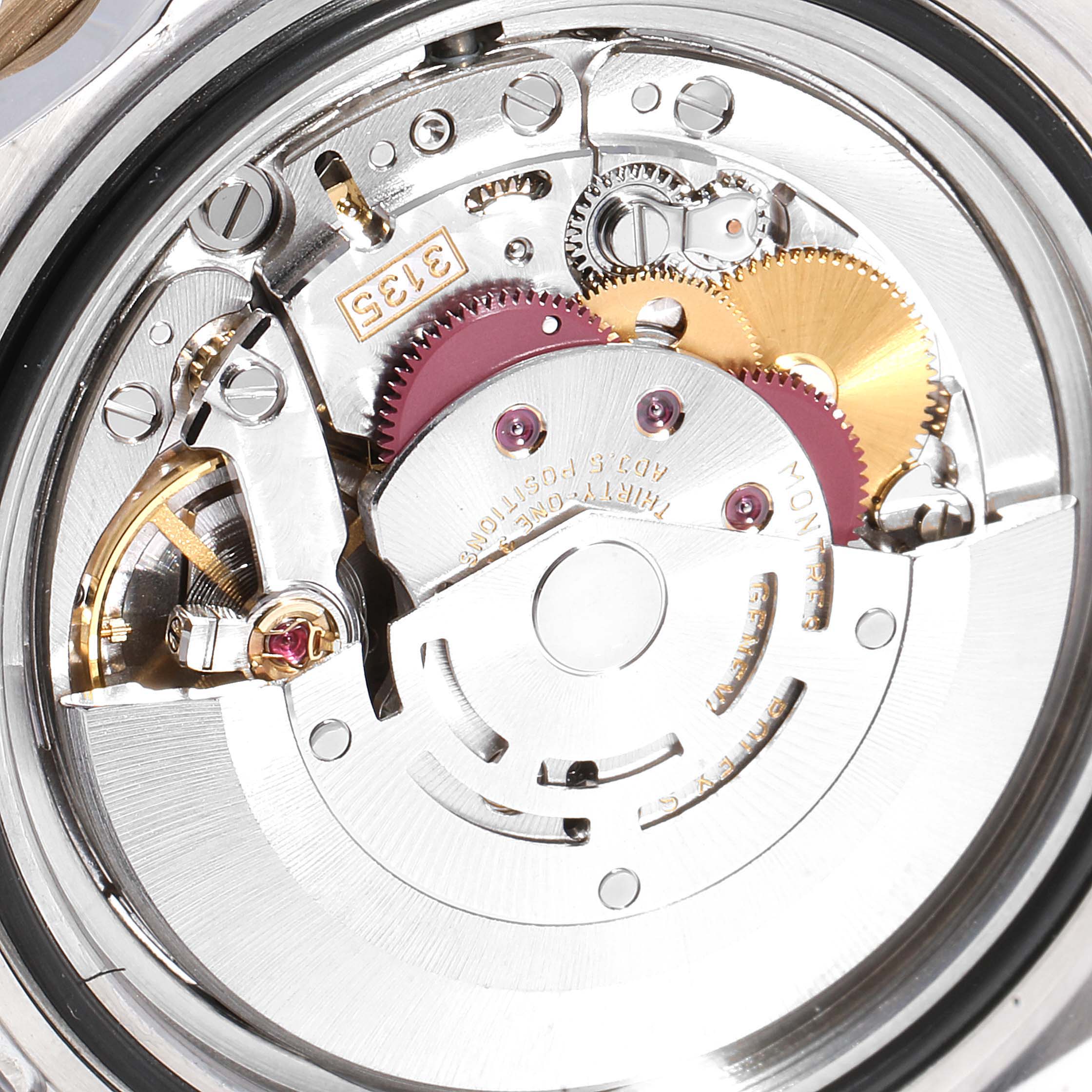 The image shows a close-up of the internal movement mechanism of a Rolex Submariner 16613 Men
s Steel and Gold (two tone) Blue Dial 16613 Men
s Steel and Gold (two tone) Blue Dial watch.