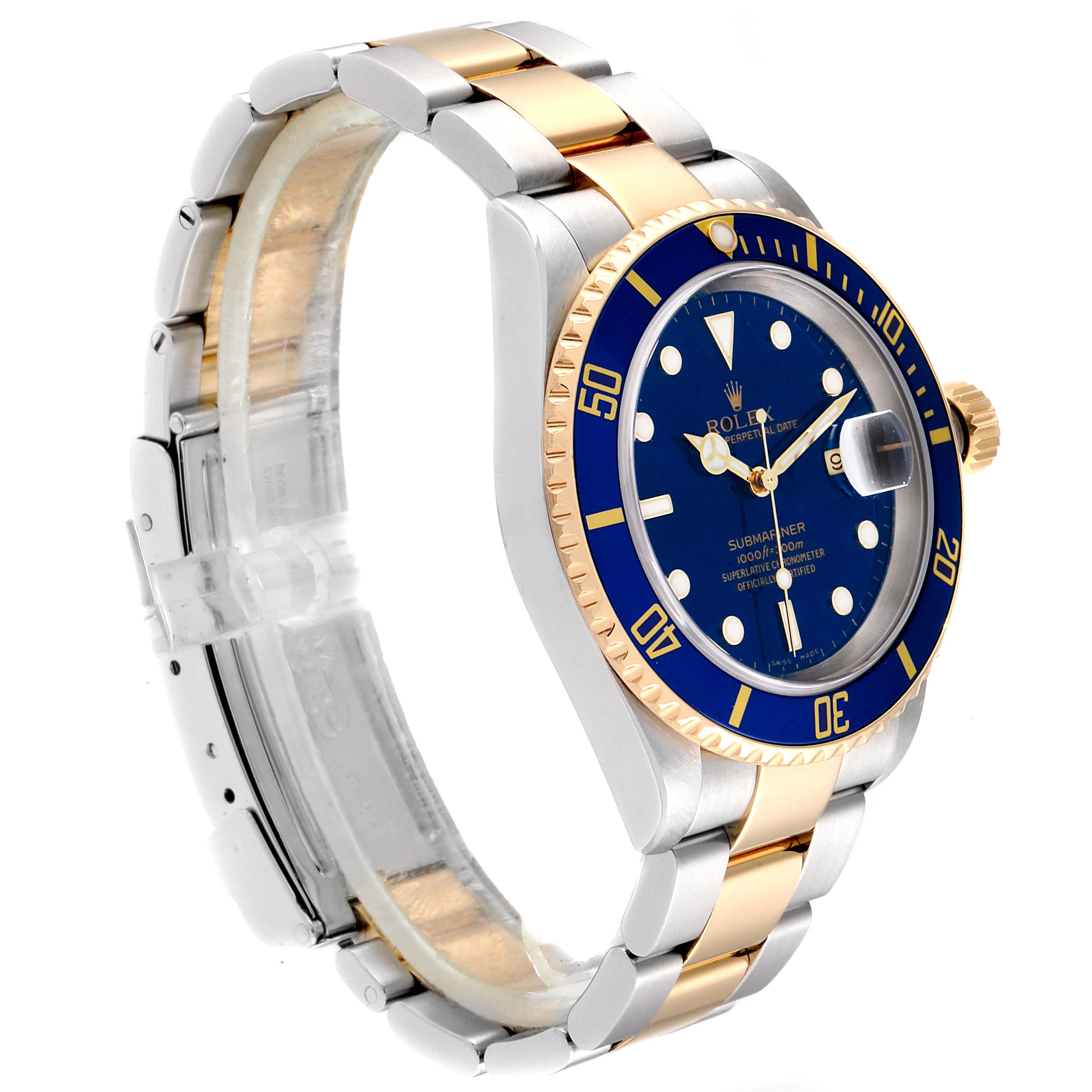 The image shows a Rolex Submariner 16613 Men
s Steel and Gold (two tone) Blue Dial 16613 Men
s Steel and Gold (two tone) Blue Dial watch from a side angle, highlighting its blue dial, bezel, and two-tone metal bracelet.